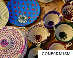 CONFORMISM anagram