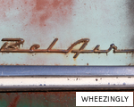 WHEEZINGLY anagram
